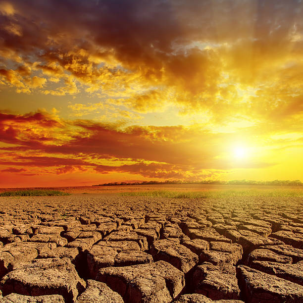 istock orange sunset in cloudy sky over desert 513472437