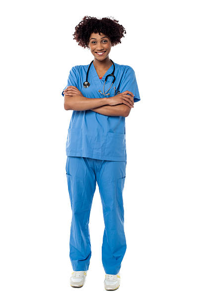 istock Cheerful nurse posing with arms crossed 513472723