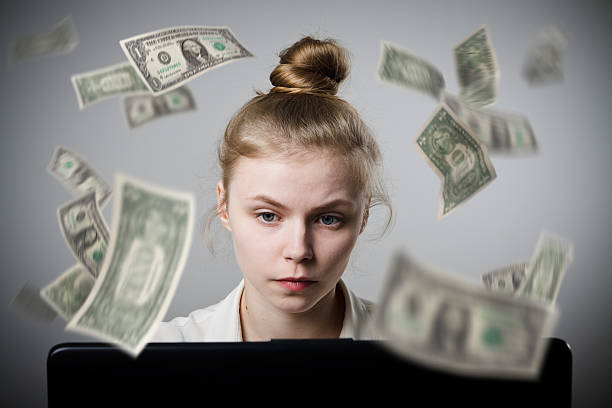 istock Woman earns dollars on the internet 513472732