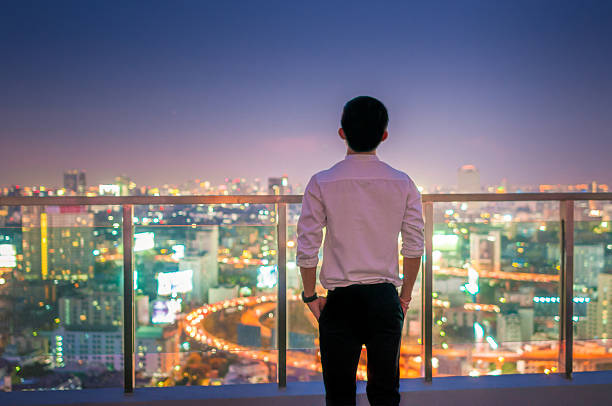 istock Businessman  on the rooftop of a skyscraper 513473310
