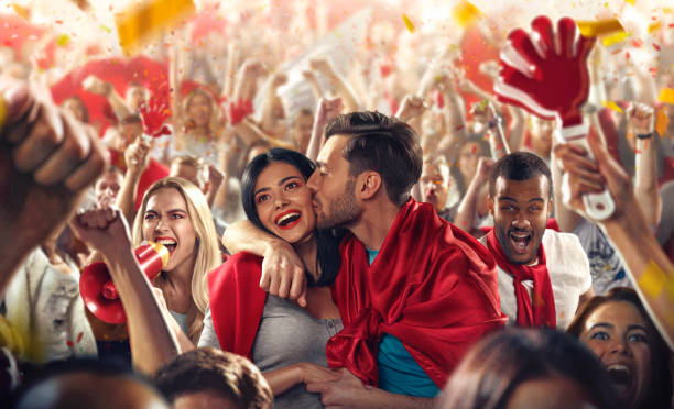 istock Sport fans: Man kisses woman 513473498