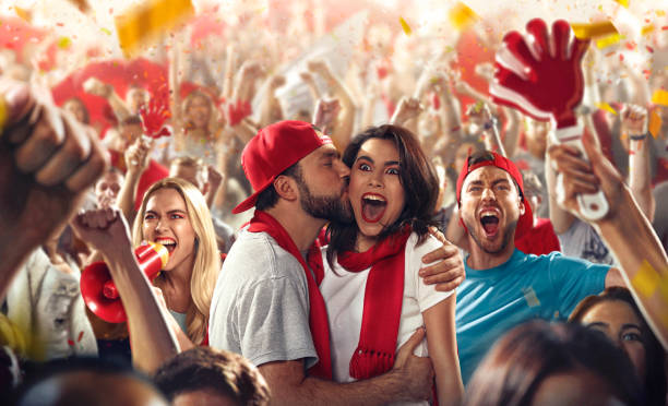 istock Sport fans: Man kisses woman 513473686