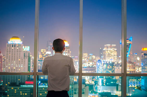 istock Businessman  on the rooftop of a skyscraper 513474076