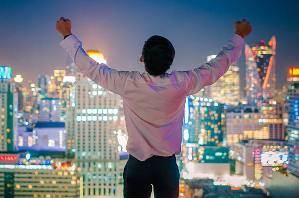 istock Businessman  on the rooftop of a skyscraper 513474372