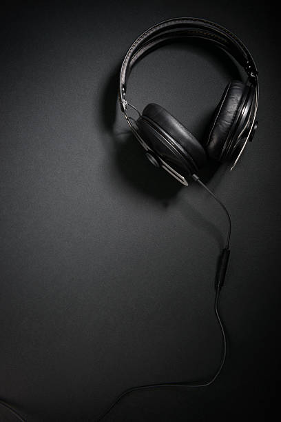 istock DJ headphones on black background, from above 513475038
