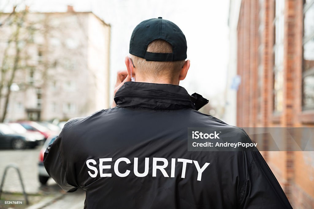 Security Guard Wearing Jacket Close-up Of Male Security Guard Wearing Black Jacket Security Guard Stock Photo