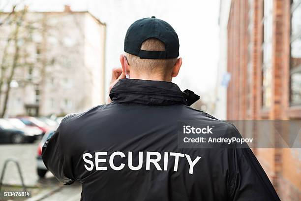 Security Guard Wearing Jacket Stock Photo - Download Image Now - Security Guard, Security Staff, Security