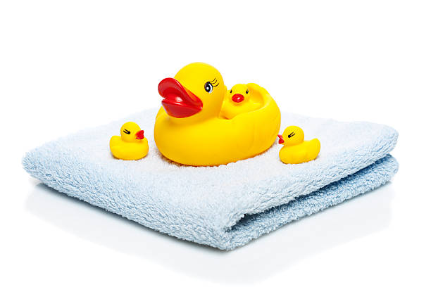 istock Bath towel and Yellow rubber ducks 513477184
