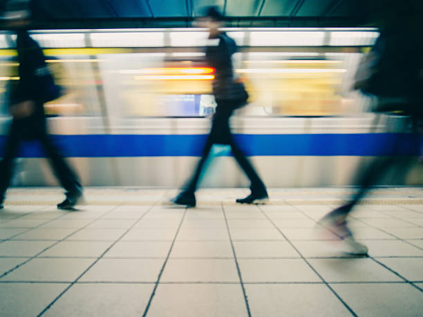 istock Subway train leaving station. People on platform. 513477360