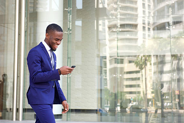 istock Happy young man reading text message on his mobile phone 513479762