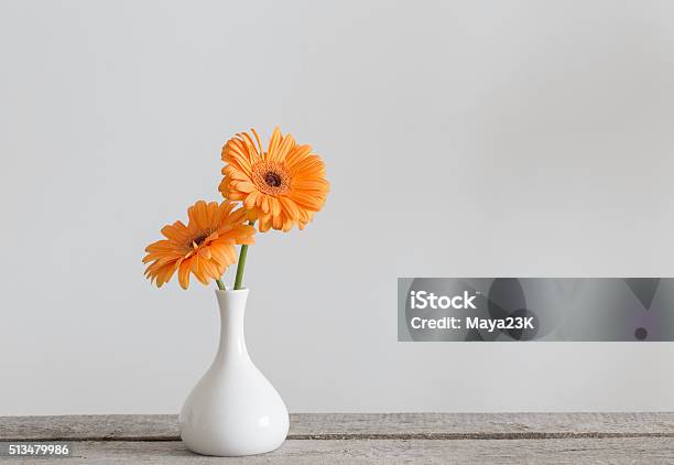 Gerbera In Vase On Old Wooden Table Stock Photo - Download Image Now - Vase, Flower, Table