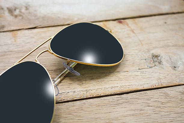 istock sun glasses on wood 513480554