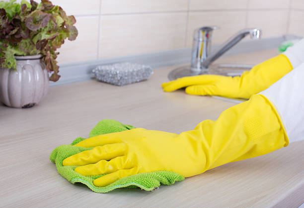 Cleaning kitchen countertop stock photo