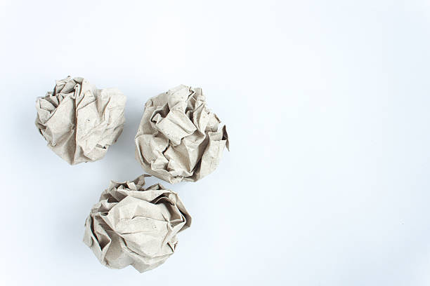 istock crumled paper on white background, close up, soft focus 513482270