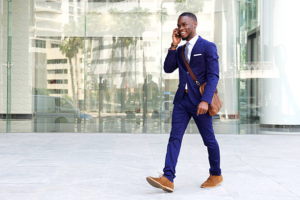 istock Confident young businessman using cell phone in city 513483642