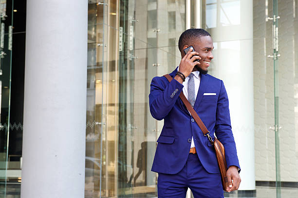 istock Young african businessman talking on mobile phone 513484140