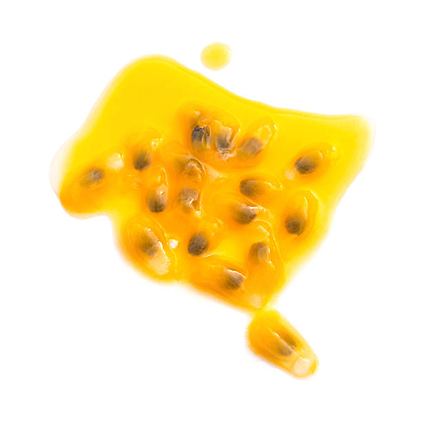 istock passion fruit cut out with some juice on white background 513484856