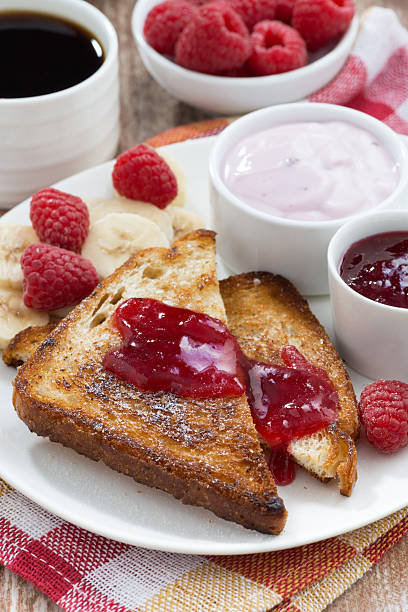 istock sweet toasts with fresh raspberry, jam and yoghurt for breakfast 513485448