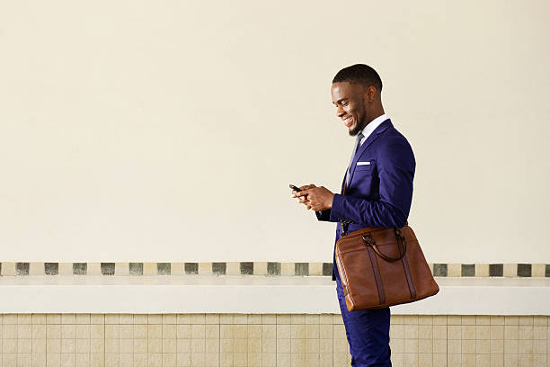istock Businessman reading text message on mobile phone 513485630