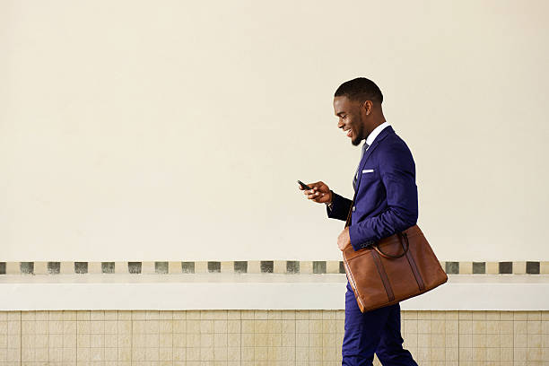istock Young man sending text message on his mobile phone 513486040