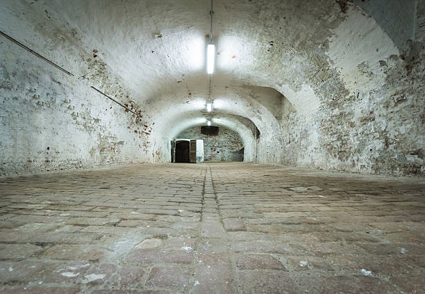 Basement of old fortress with vaulted brick ceiling - ancient dungeons