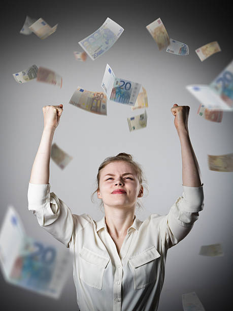istock Rejoicing. Girl in white and Euro. 513487584