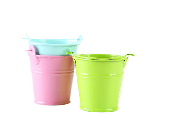 istock Colorful buckets isolated on white 513488294