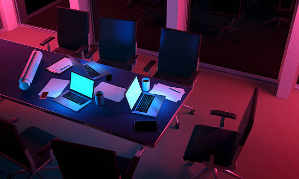 Teamwork: working at night with laptop computers on office desk
