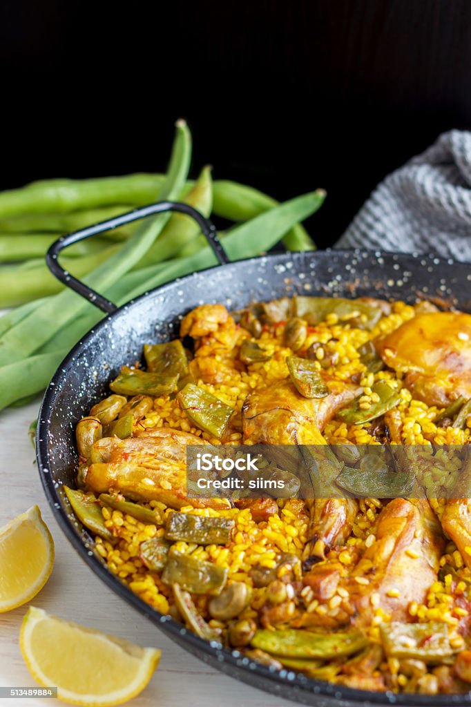 Paella Valenciana - Spanish Food Traditional Paella Valenciana is a great dish to share with family and friends! Paella Stock Photo