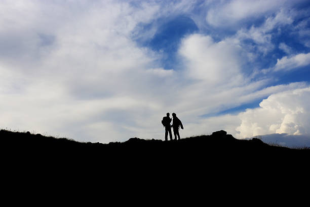The male standing on the foggy mountain. evening night time