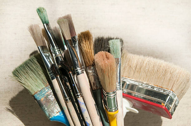 istock Bunch of used paint brushes 513492338