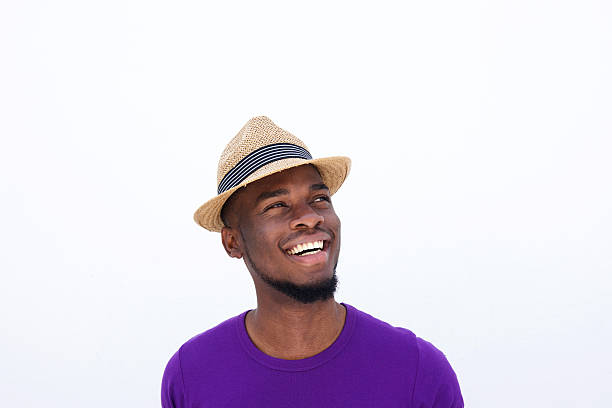 istock Young man with hat looking away and smiling 513493014