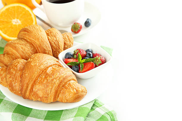istock Fresh tasty croissants with berries on white background 513493842