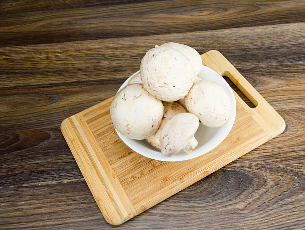 istock Mushrooms in a white plate 513493868