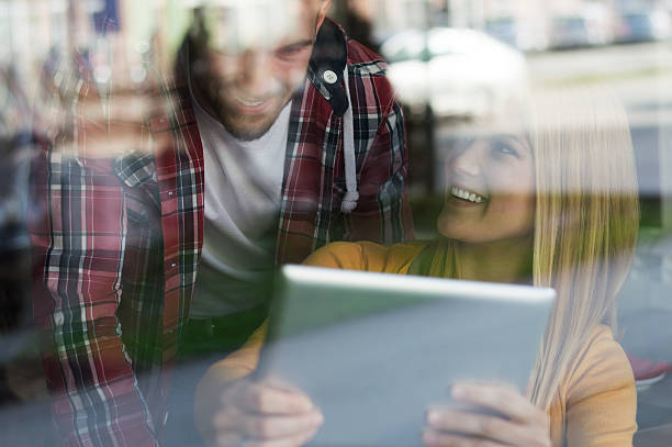 istock Young couple in cafe use digital tablet 513494042