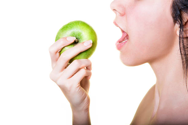 istock Young  and beautiful woman holding fresh apple 513494066