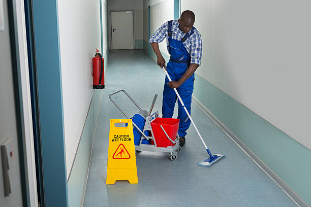 istock Male Janitor Cleaning Floor 513494854