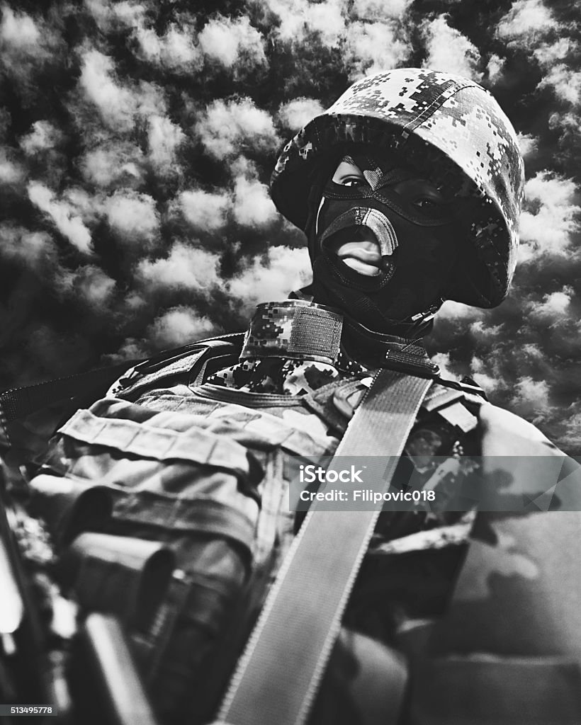 Special Forces Soldier in combat universal camouflage uniform & helmet., black and white Adult Stock Photo