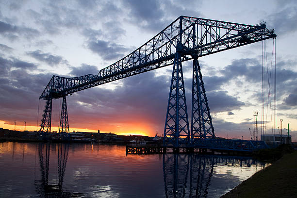 The Transporter Bridge, Teesside, at sunset The transporter bridge, Teesside, silhouetted against an evening sky. cleveland england stock pictures, royalty-free photos & images