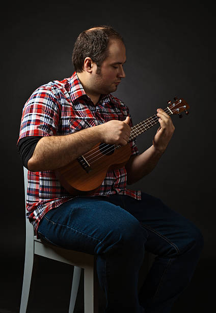istock portrait of musician with ukulele 513497698