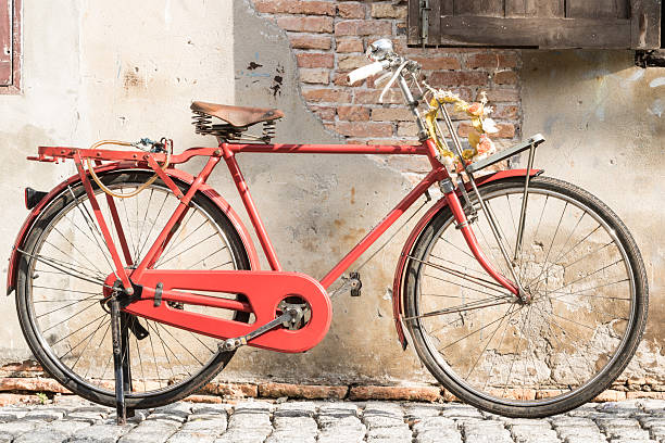 istock Antique bikes in the old wall. 513498976