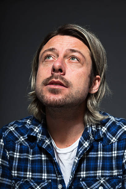 istock Expressive young man with blond long hair and beard. 513499751