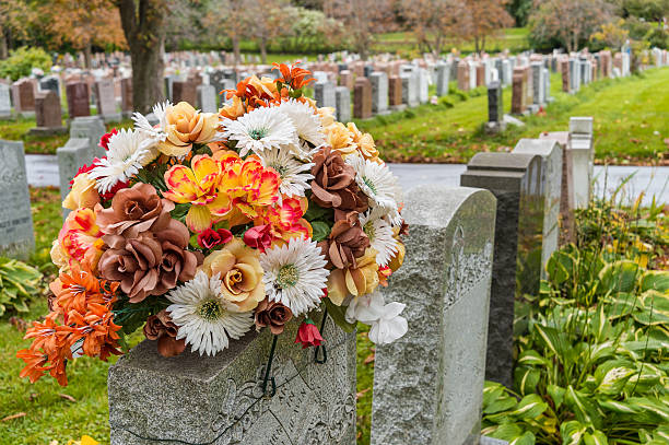 flowers on a tombstone in a cemetary - blommor grav bildbanksfoton och bilder
