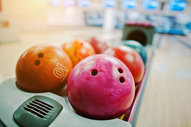 istock Group of colored bowling balls at bowl lift 513499998