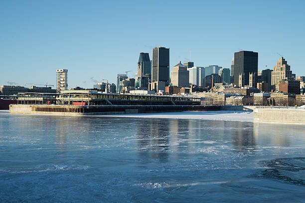 istock Montreal skyline in winter, with frozen St-Lawrence river 513500302