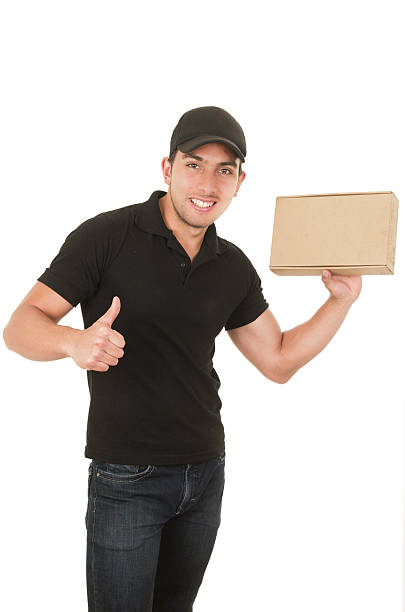 istock happy friendly confident delivery man carrying boxes 513506459