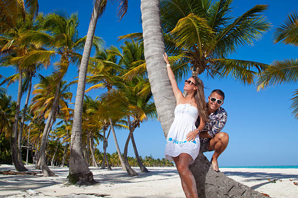 istock Vacation couple relaxing on beach together in love 513533175