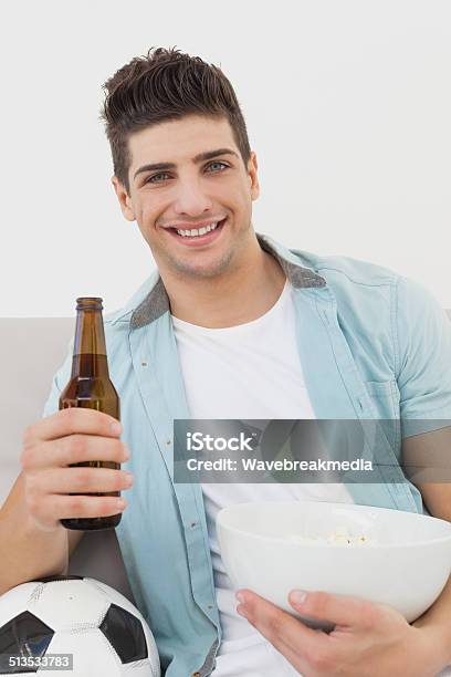 Happy Soccer Fan Watching Tv Stock Photo - Download Image Now - 20-24 Years, 20-29 Years, Adult