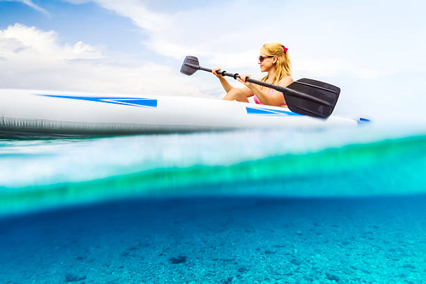 istock Woman kayaking on the blue sea. 513533979