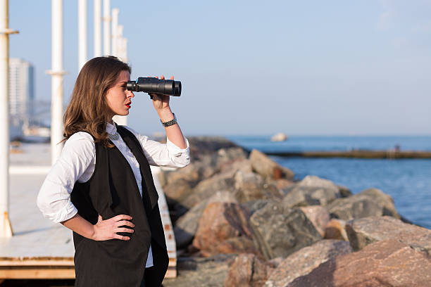 istock Business woman with a pair of binoculars 513534162